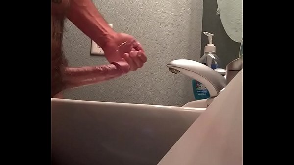 Hung man jerking off fat cock with cumshot.