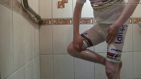 Masturbating under shower in white bicycle clothing