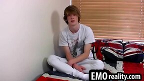 Blonde emo teen talks to the camera and then removes his clothes