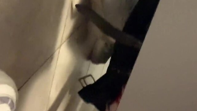 Man masturbates and pleasures stranger in public toilet stall