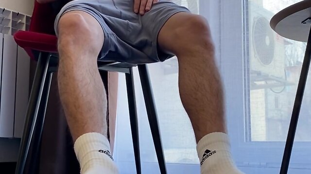 Man with hairy legs in white adidas socks jerking off penis