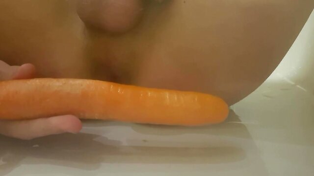 Young fucks a 9 inch carrot and tries double penetration